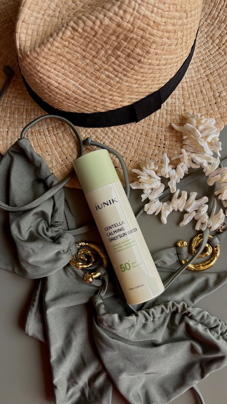 IUNIK Centella Calming Daily Sun Water — styled flatlay